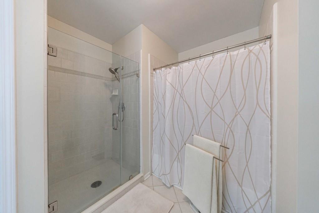 3334 Peachtree Road Northeast, Unit 1506 Atlanta, GA 30326 - Photo 18 of 51 a bathroom with a shower and a sink