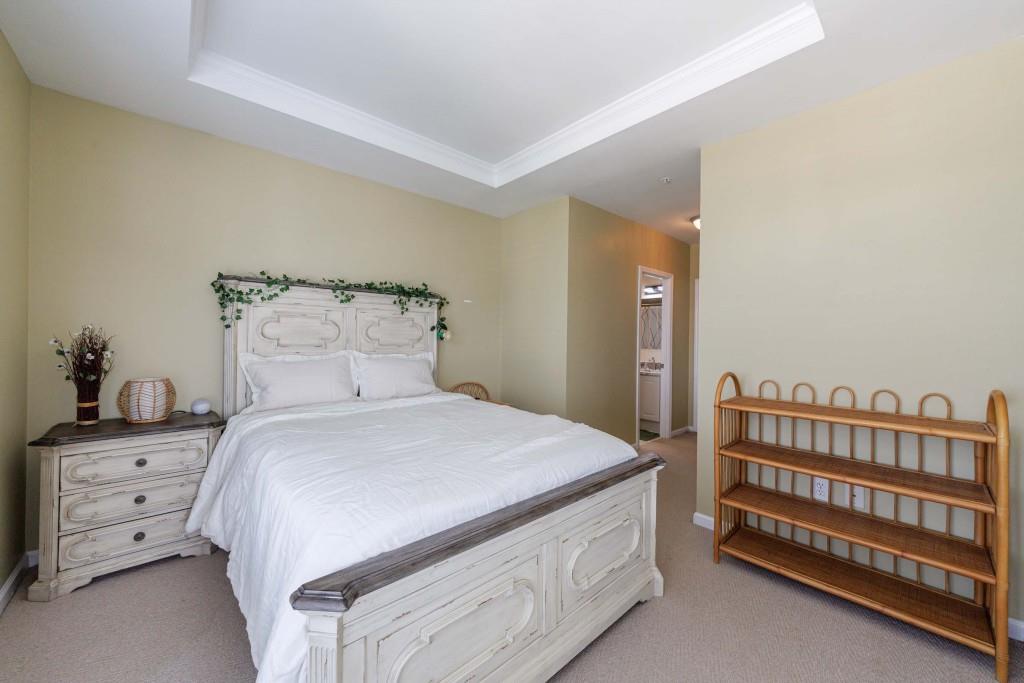 3334 Peachtree Road Northeast, Unit 1506 Atlanta, GA 30326 - Photo 19 of 51 a bedroom with a bed and a dresser