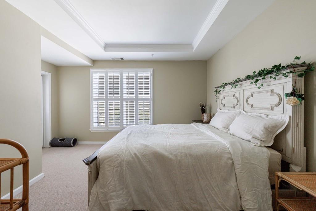 3334 Peachtree Road Northeast, Unit 1506 Atlanta, GA 30326 - Photo 20 of 51 a bedroom with a bed and a window