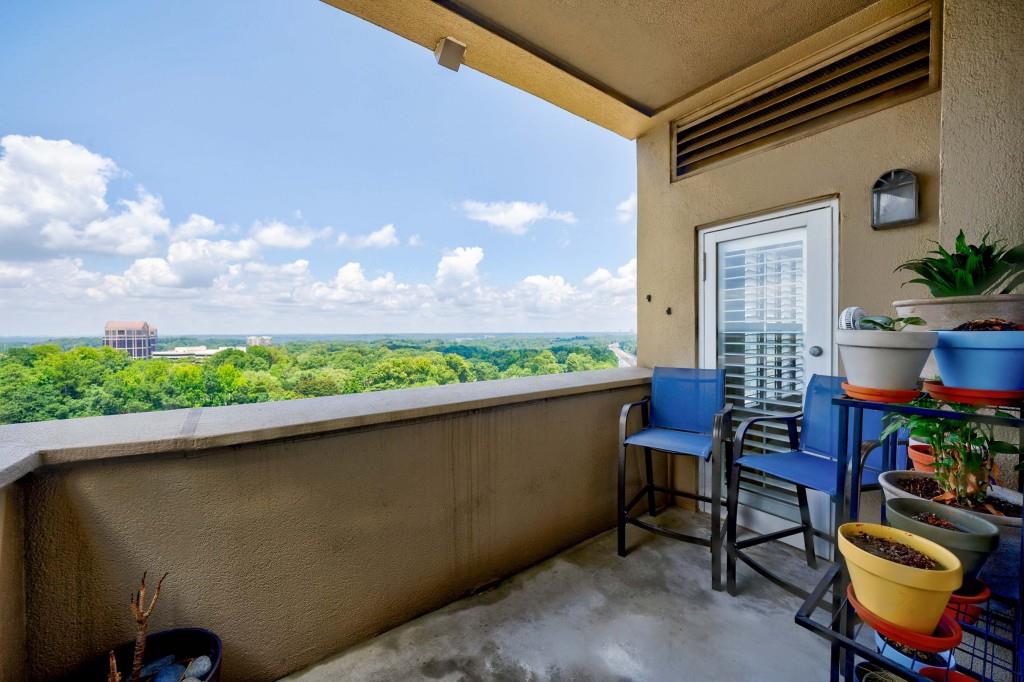 3334 Peachtree Road Northeast, Unit 1506 Atlanta, GA 30326 - Photo 23 of 51 a balcony with table and chairs