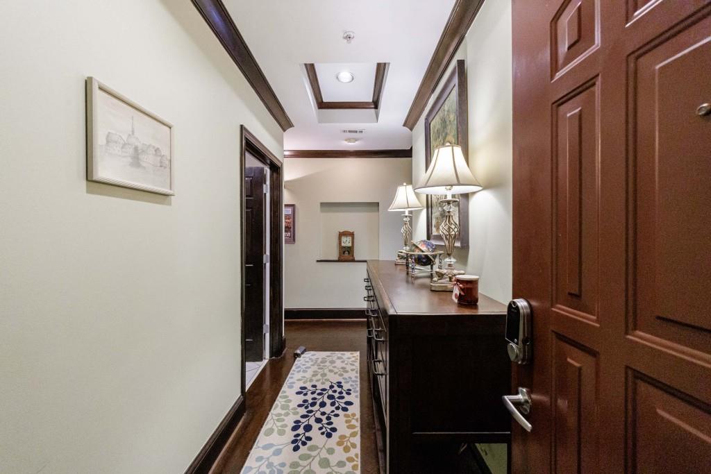 3334 Peachtree Road Northeast, Unit 1506 Atlanta, GA 30326 - Photo 27 of 51 a bathroom with a sink a mirror and a shower