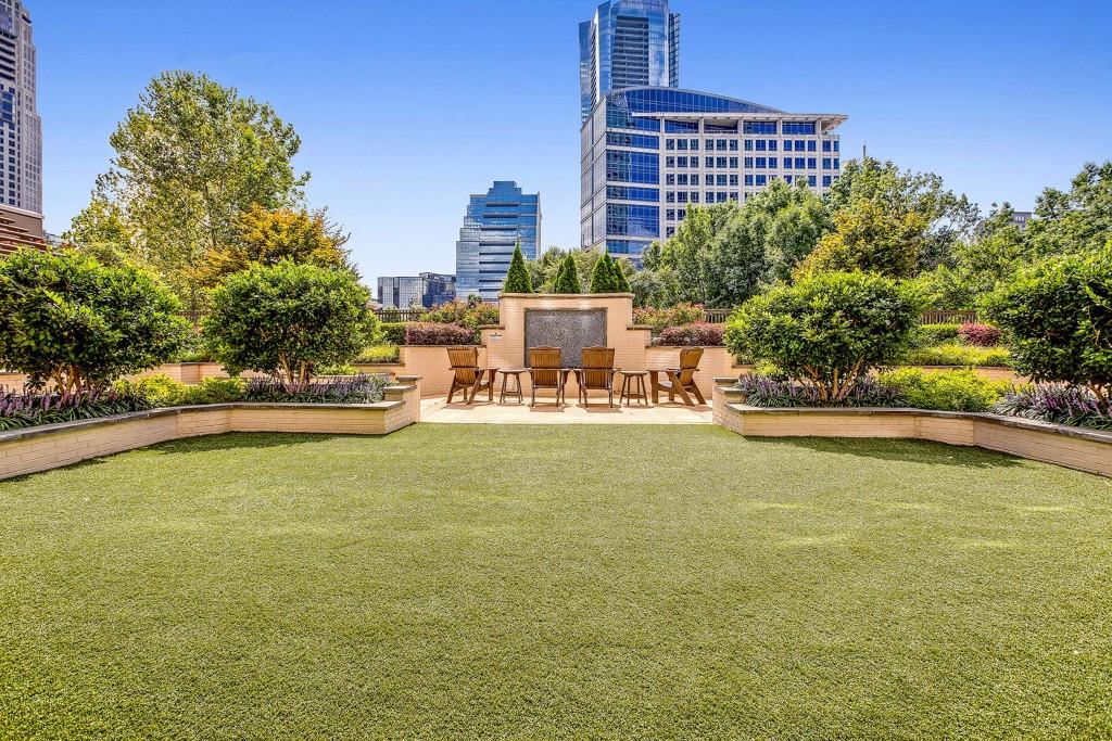 3334 Peachtree Road Northeast, Unit 1506 Atlanta, GA 30326 - Photo 34 of 51 a swimming pool with outdoor seating and yard