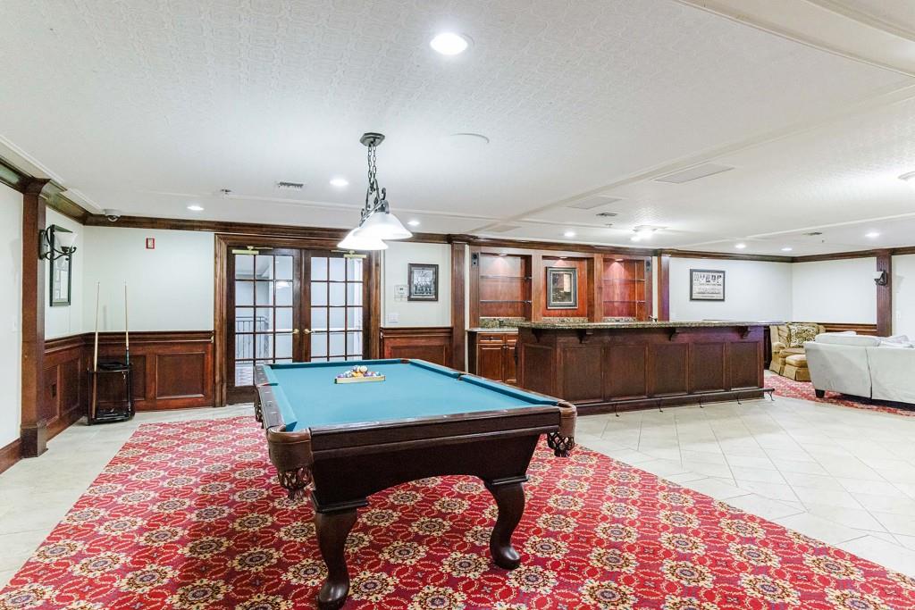 3334 Peachtree Road Northeast, Unit 1506 Atlanta, GA 30326 - Photo 39 of 51 a living room with furniture pool table and flat screen tv
