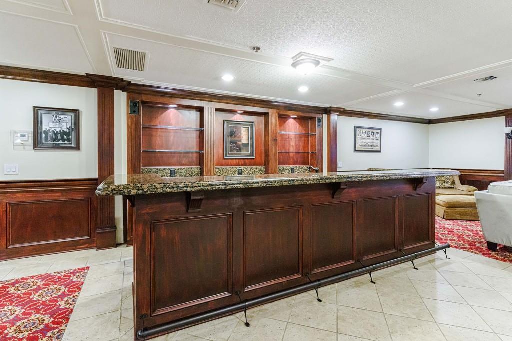 3334 Peachtree Road Northeast, Unit 1506 Atlanta, GA 30326 - Photo 40 of 51 a kitchen with granite countertop a stove and cabinets