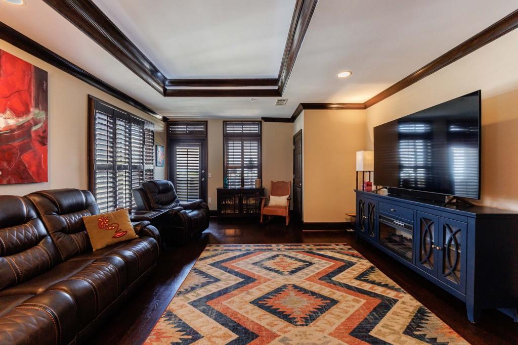 3334 Peachtree Road Northeast, Unit 1506 Atlanta, GA 30326 - Photo 4 of 51 a living room with furniture and a flat screen tv