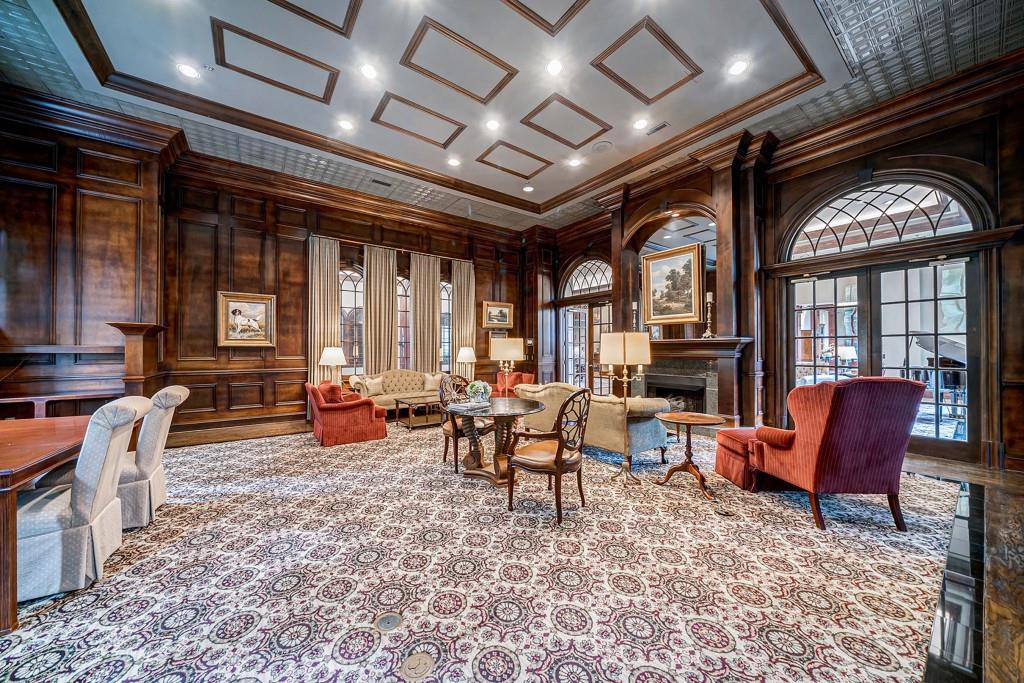 3334 Peachtree Road Northeast, Unit 1506 Atlanta, GA 30326 - Photo 42 of 51 a living room with furniture a chandelier and a large window