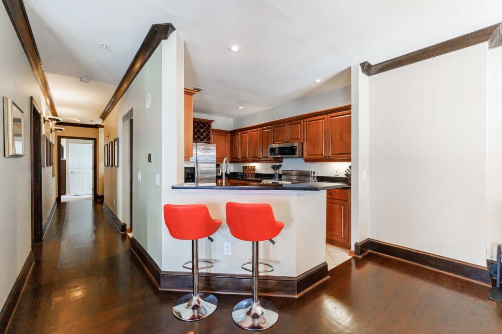3334 Peachtree Road Northeast, Unit 1506 Atlanta, GA 30326 - Photo 6 of 51 a kitchen with stainless steel appliances granite countertop a refrigerator a sink and a stove