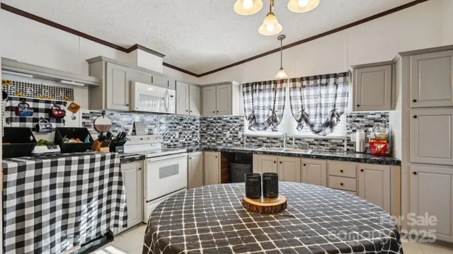 a kitchen with refrigerator and cabinets
