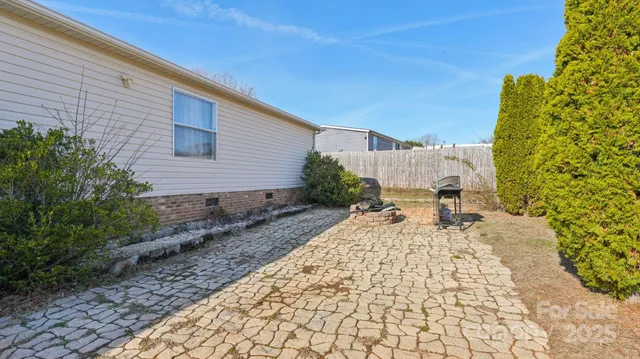 a view of a backyard with sitting area