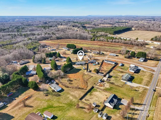 a view of walk in closet with clothes