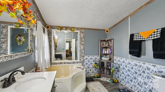 a living room with furniture and flowers