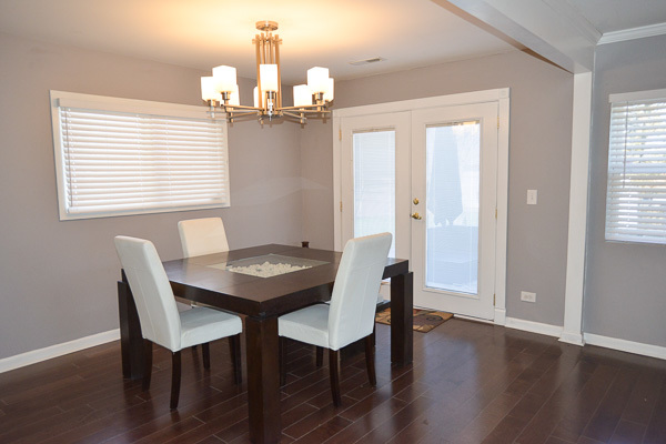 720 Durham Lane Hoffman Estates, IL 60169 - Photo 13 of 34 a view of a dining room with furniture and wooden floor