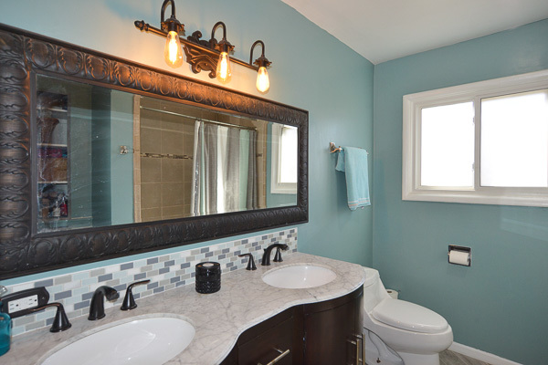 720 Durham Lane Hoffman Estates, IL 60169 - Photo 17 of 34 a bathroom with a double vanity sink toilet and a mirror