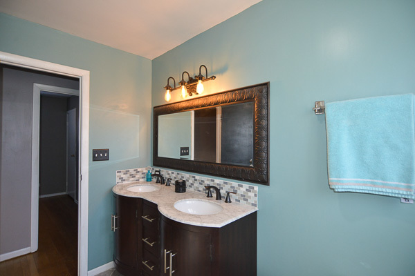 720 Durham Lane Hoffman Estates, IL 60169 - Photo 18 of 34 a bathroom with a sink and a mirror