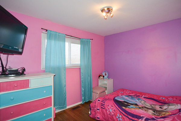 720 Durham Lane Hoffman Estates, IL 60169 - Photo 20 of 34 a bedroom with a bed and a flat screen tv