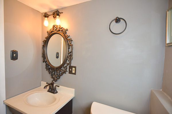 720 Durham Lane Hoffman Estates, IL 60169 - Photo 24 of 34 a bathroom with a toilet a sink and mirror