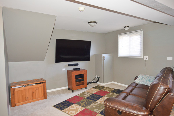 720 Durham Lane Hoffman Estates, IL 60169 - Photo 25 of 34 a living room with furniture and a flat screen tv