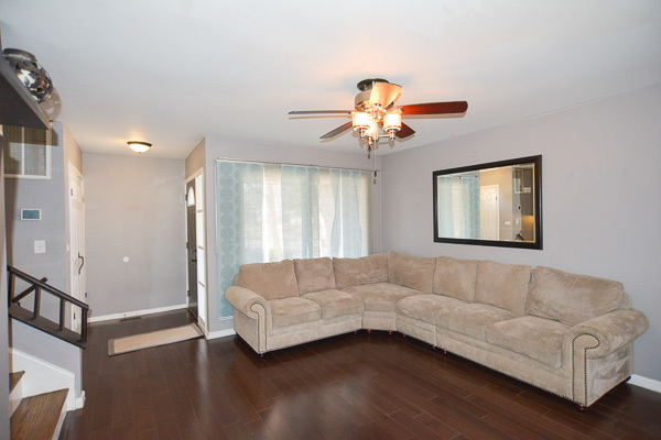 720 Durham Lane Hoffman Estates, IL 60169 - Photo 5 of 34 a living room with furniture and a window