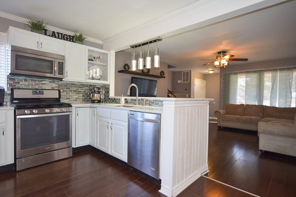 720 Durham Lane Hoffman Estates, IL 60169 - Photo 8 of 34 a kitchen with a sink stove and microwave