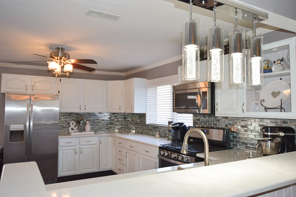 720 Durham Lane Hoffman Estates, IL 60169 - Photo 10 of 34 a kitchen with stainless steel appliances a sink a stove a refrigerator and cabinets