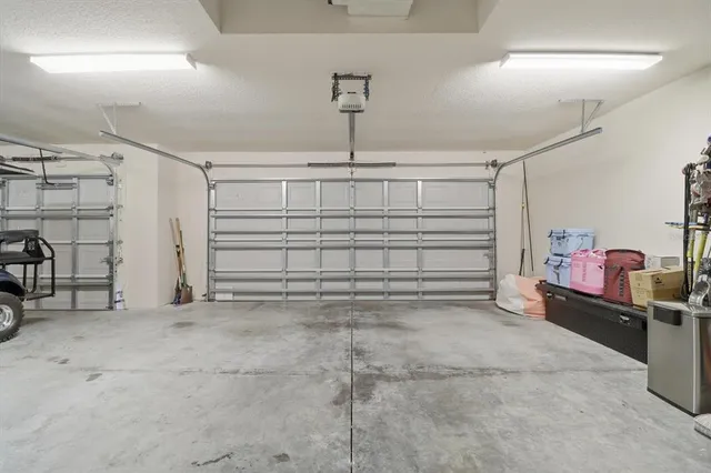 a view of a garage with a bike and car