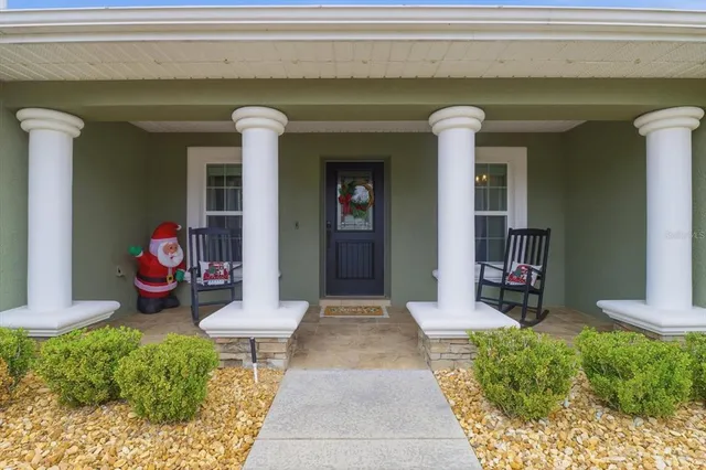 a front view of a house with a porch