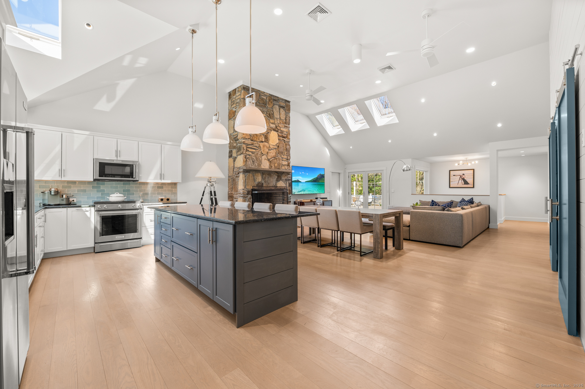 a large kitchen with stainless steel appliances lots of counter top space