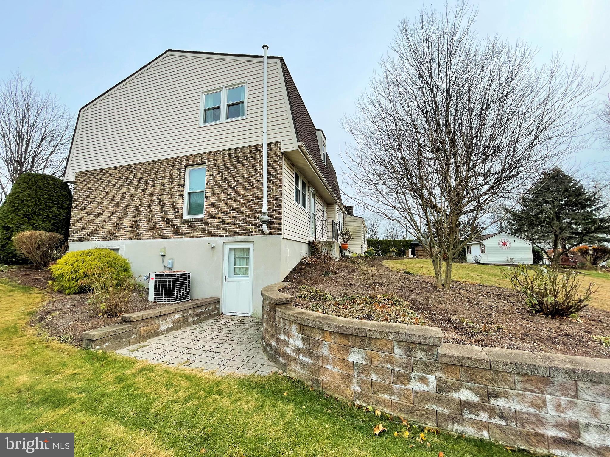 11 Thornbury Road Reading, PA 19606 - Photo 62 of 62 Side yard with Basement entrance and paver patio