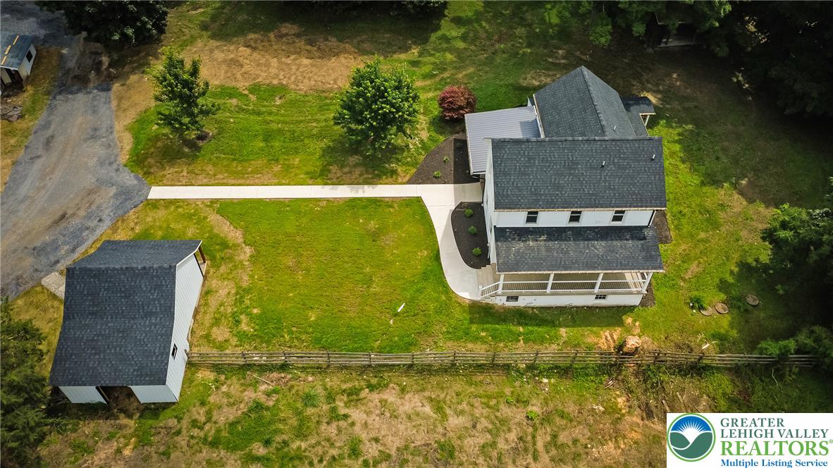 72 Allegheny Road Mount Bethel, PA 18343 - Photo 62 of 72 An aerial perspective showcases a home with a sweeping driveway, an accessory building, and vast green space.