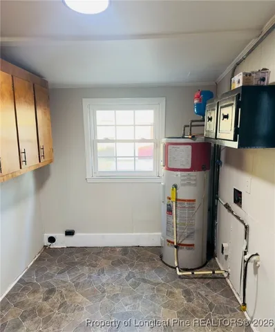 a view of workspace with wooden floor windows