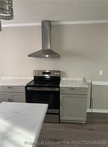 a kitchen with a stove and a microwave