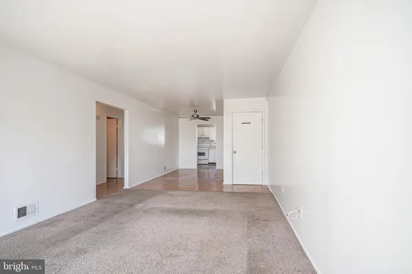 a view of empty room with a fireplace