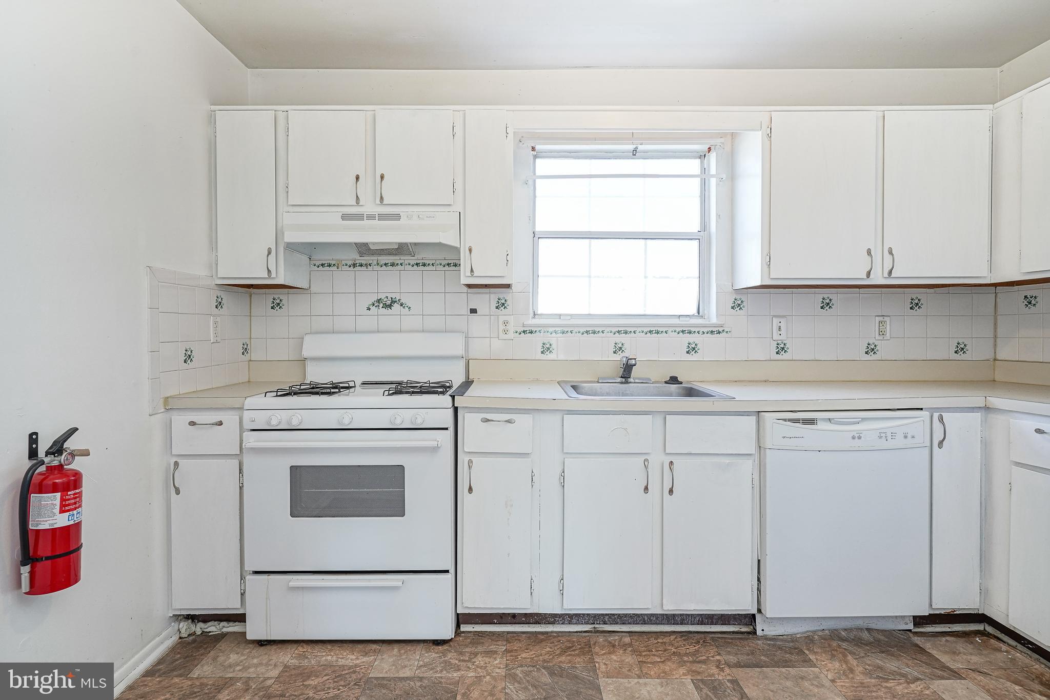 605 Woodchip Road Lumberton, NJ 08048 - Photo 3 of 18 a kitchen with cabinets appliances a sink and a window