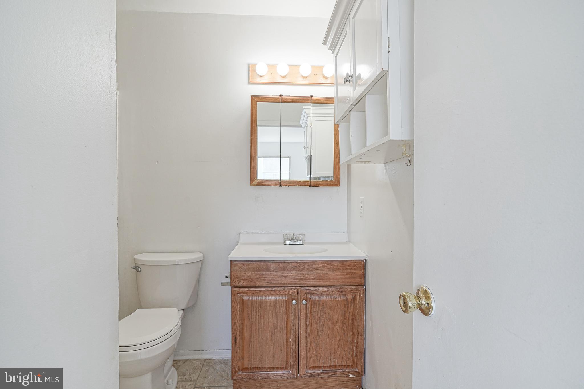 605 Woodchip Road Lumberton, NJ 08048 - Photo 7 of 18 a bathroom with a toilet sink and mirror