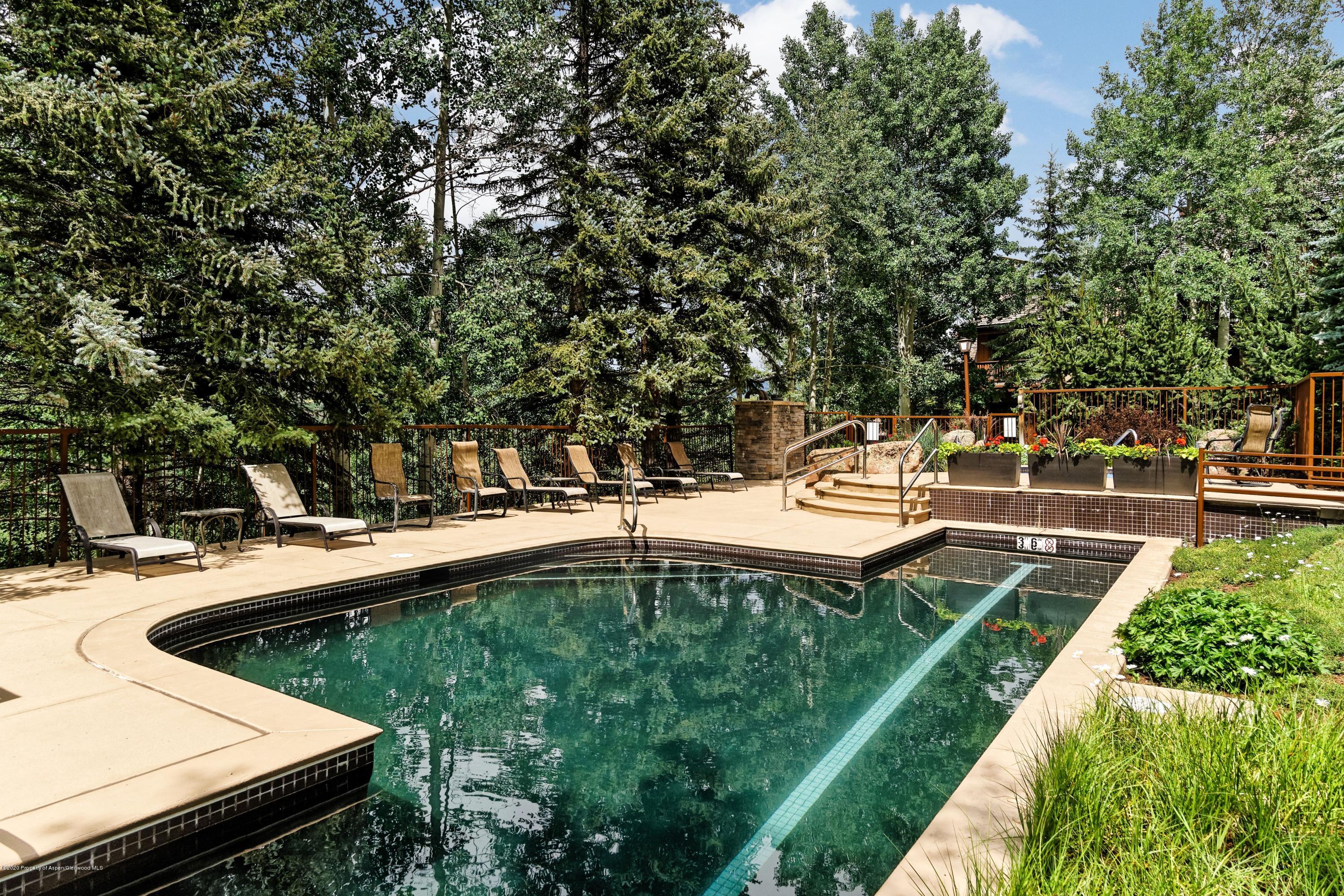 800 Ridge Road, Unit 14 Snowmass Village, CO 81615 - Photo 15 of 20 a view of a swimming pool with a patio