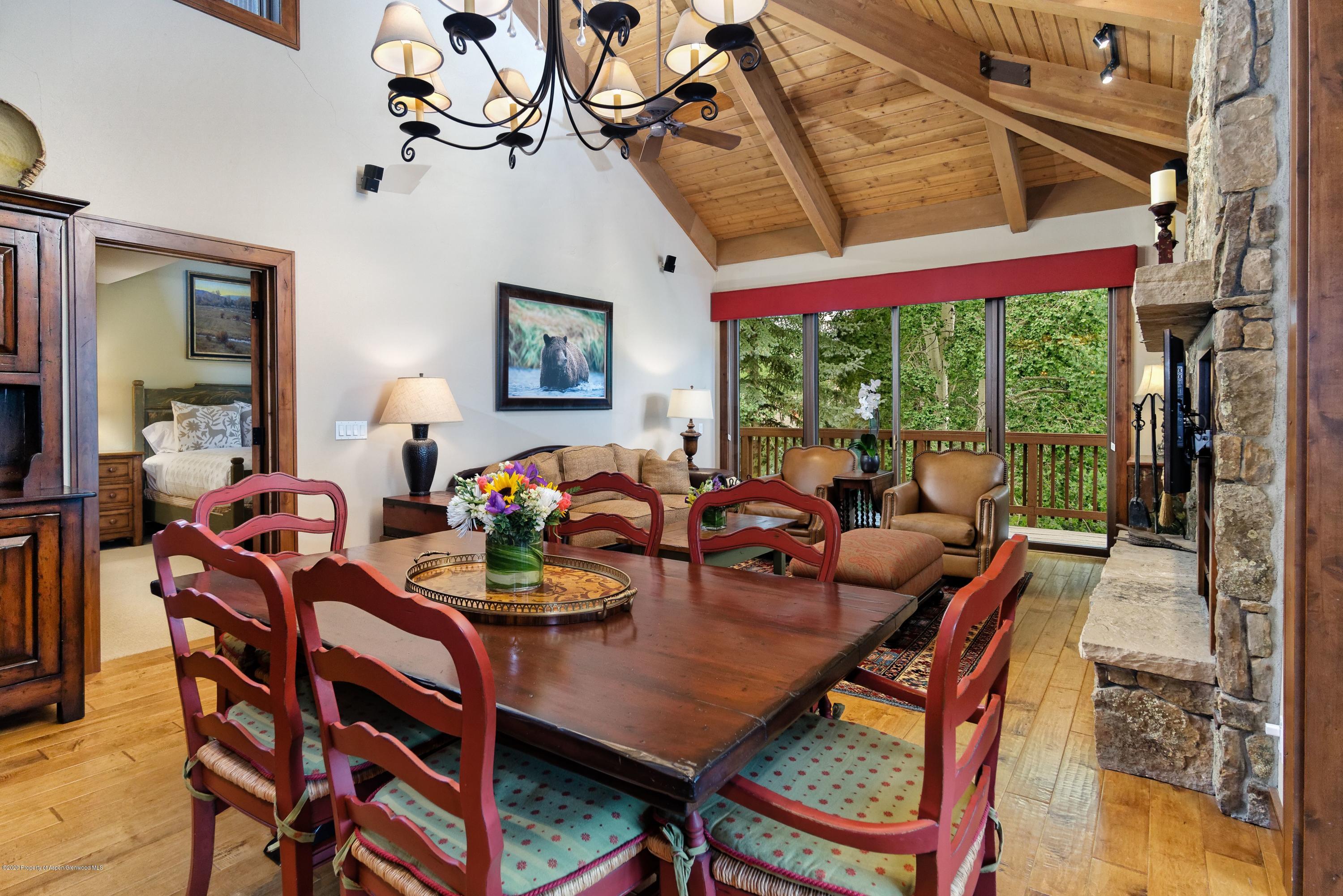 800 Ridge Road, Unit 14 Snowmass Village, CO 81615 - Photo 3 of 20 a view of a dining room with furniture window and outside view