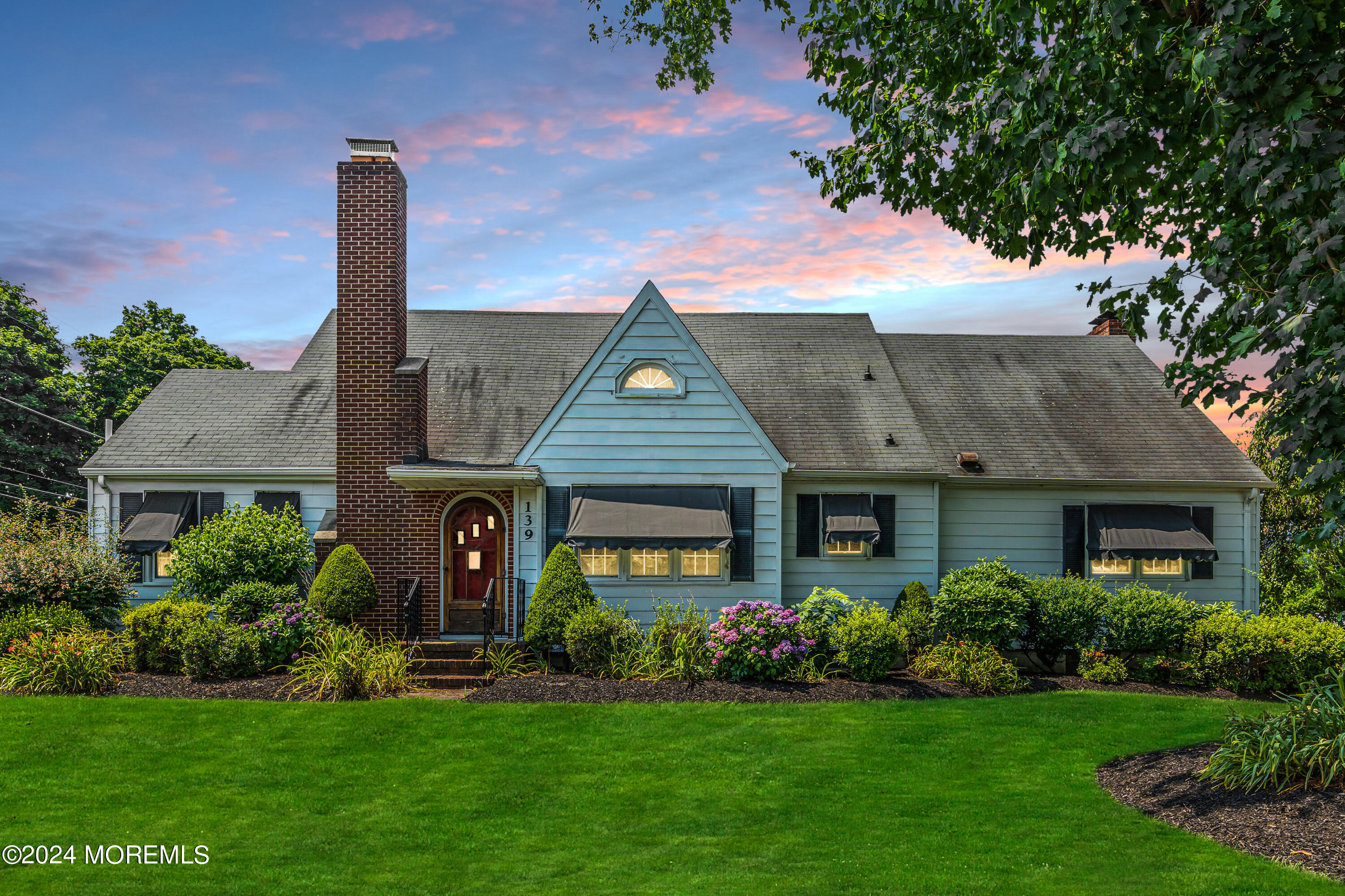 139 Broadway Road Freehold, NJ 07728 - Photo 1 of 37 a front view of a house with garden