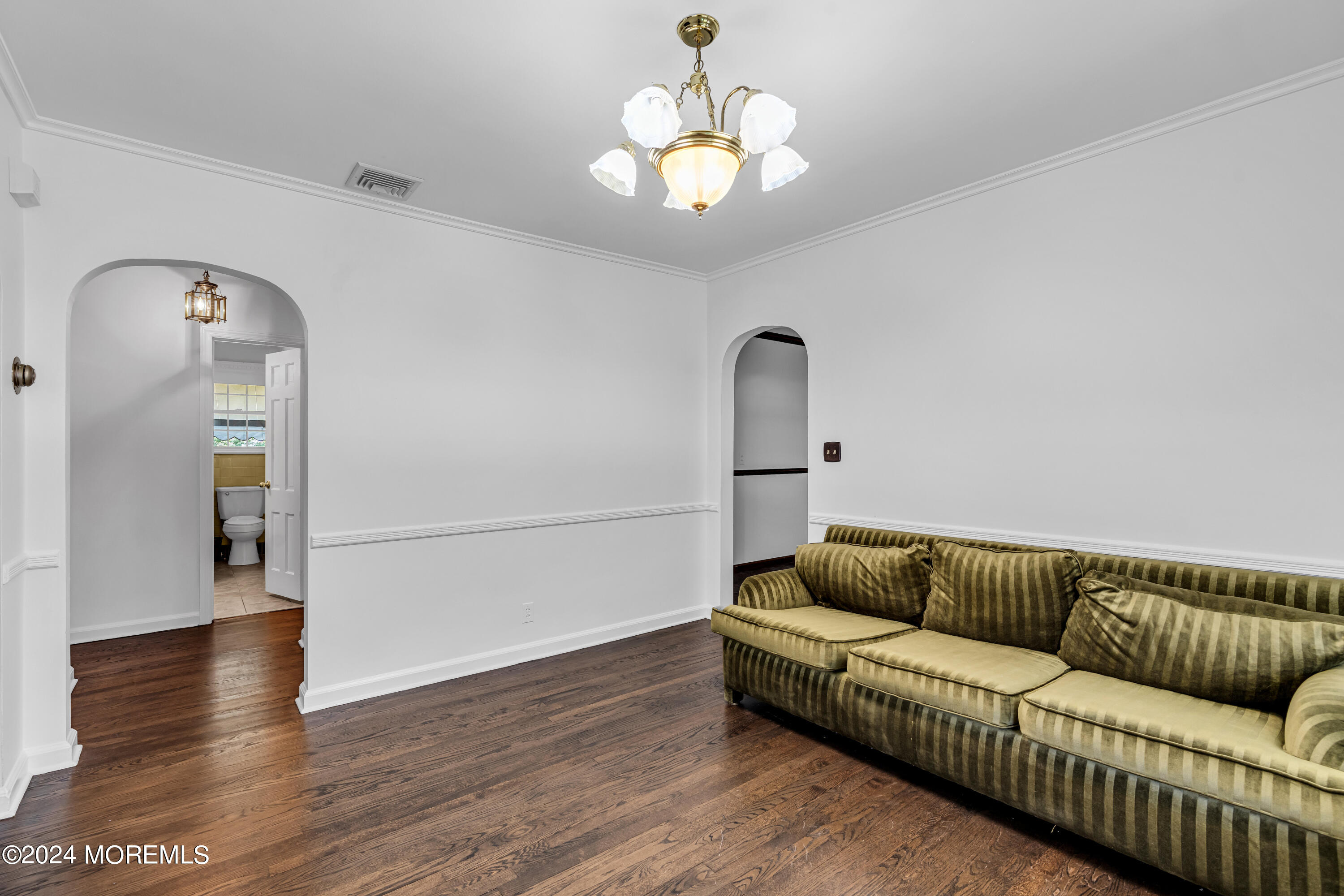 139 Broadway Road Freehold, NJ 07728 - Photo 11 of 37 a living room with furniture and a chandelier