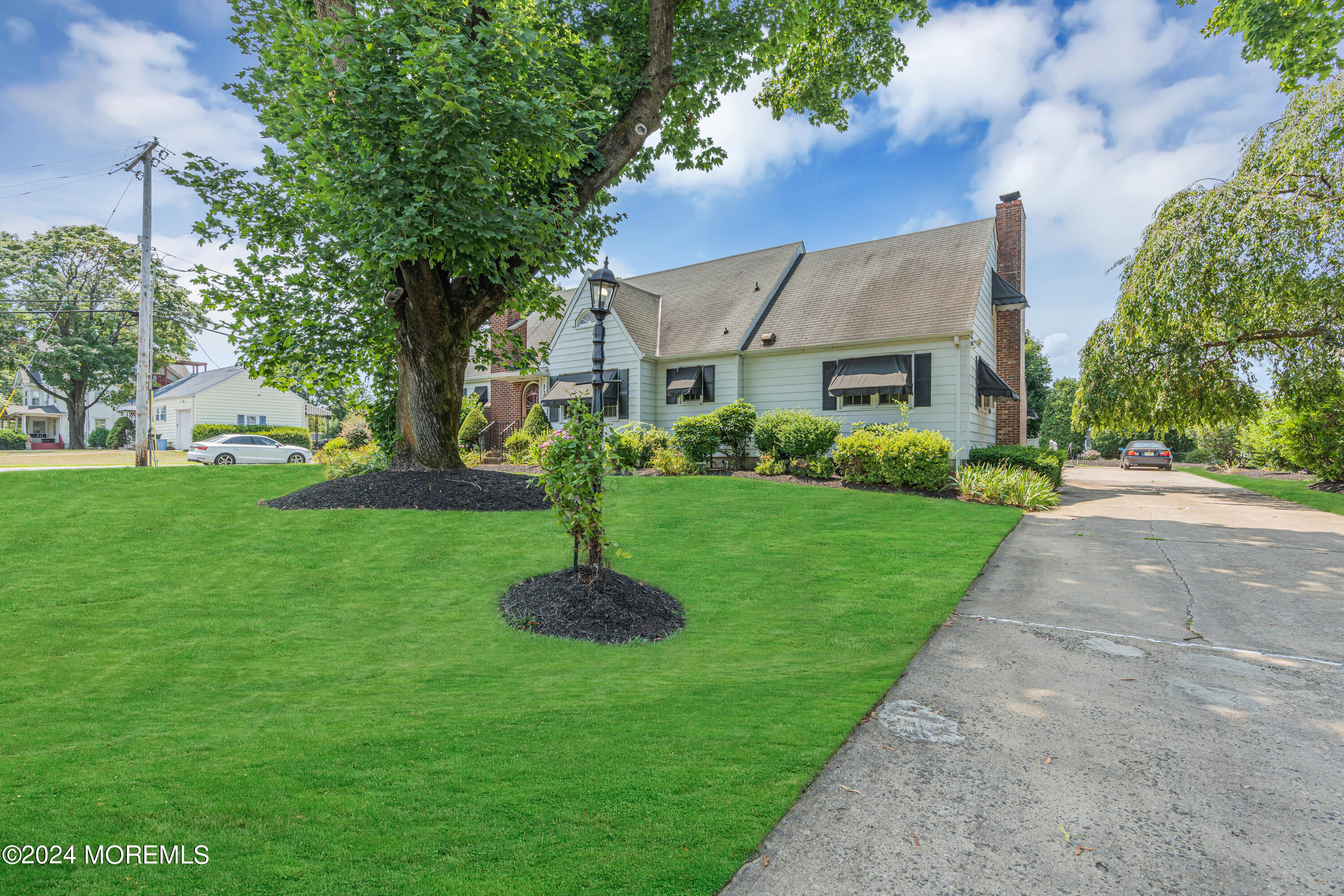 139 Broadway Road Freehold, NJ 07728 - Photo 3 of 37 a front view of a house with a garden