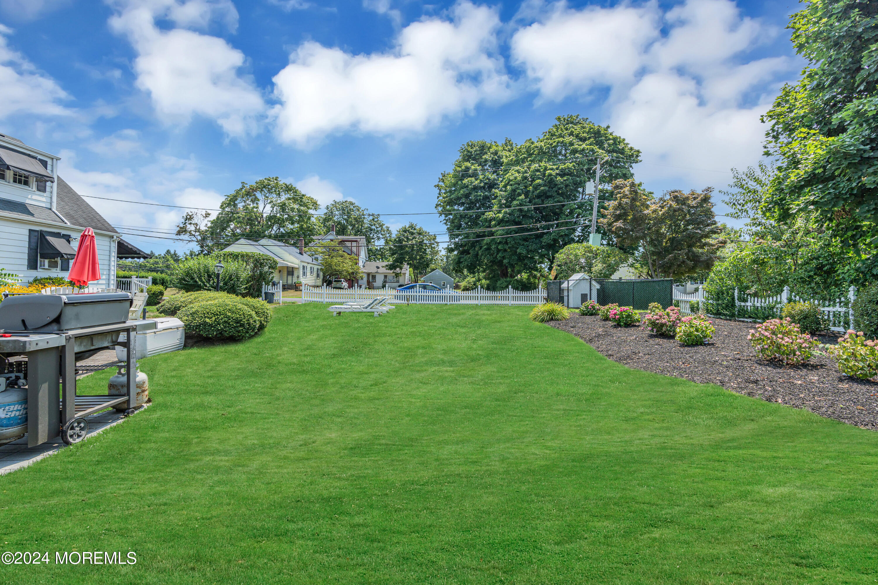 139 Broadway Road Freehold, NJ 07728 - Photo 36 of 37 a view of backyard with seating area and green space