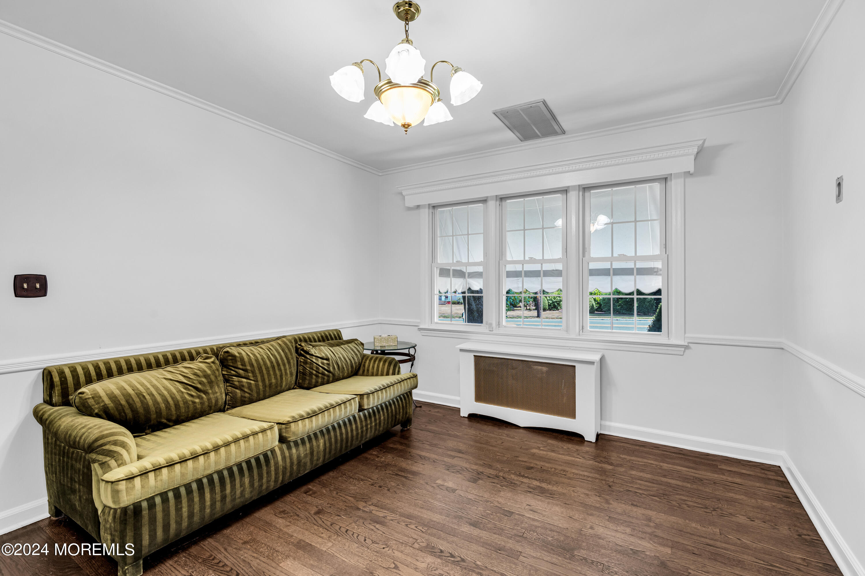 139 Broadway Road Freehold, NJ 07728 - Photo 9 of 37 a living room with furniture and a wooden floor