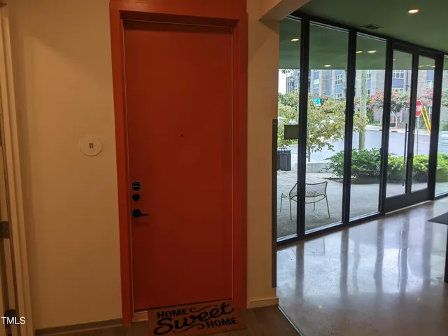 a view of a glass door with a balcony