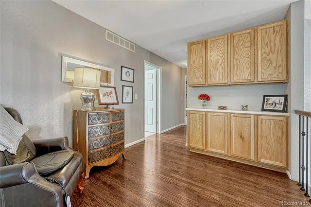 a view of kitchen with furniture and wooden floor