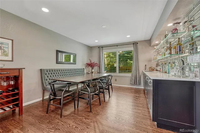a dining room with furniture window wooden floor