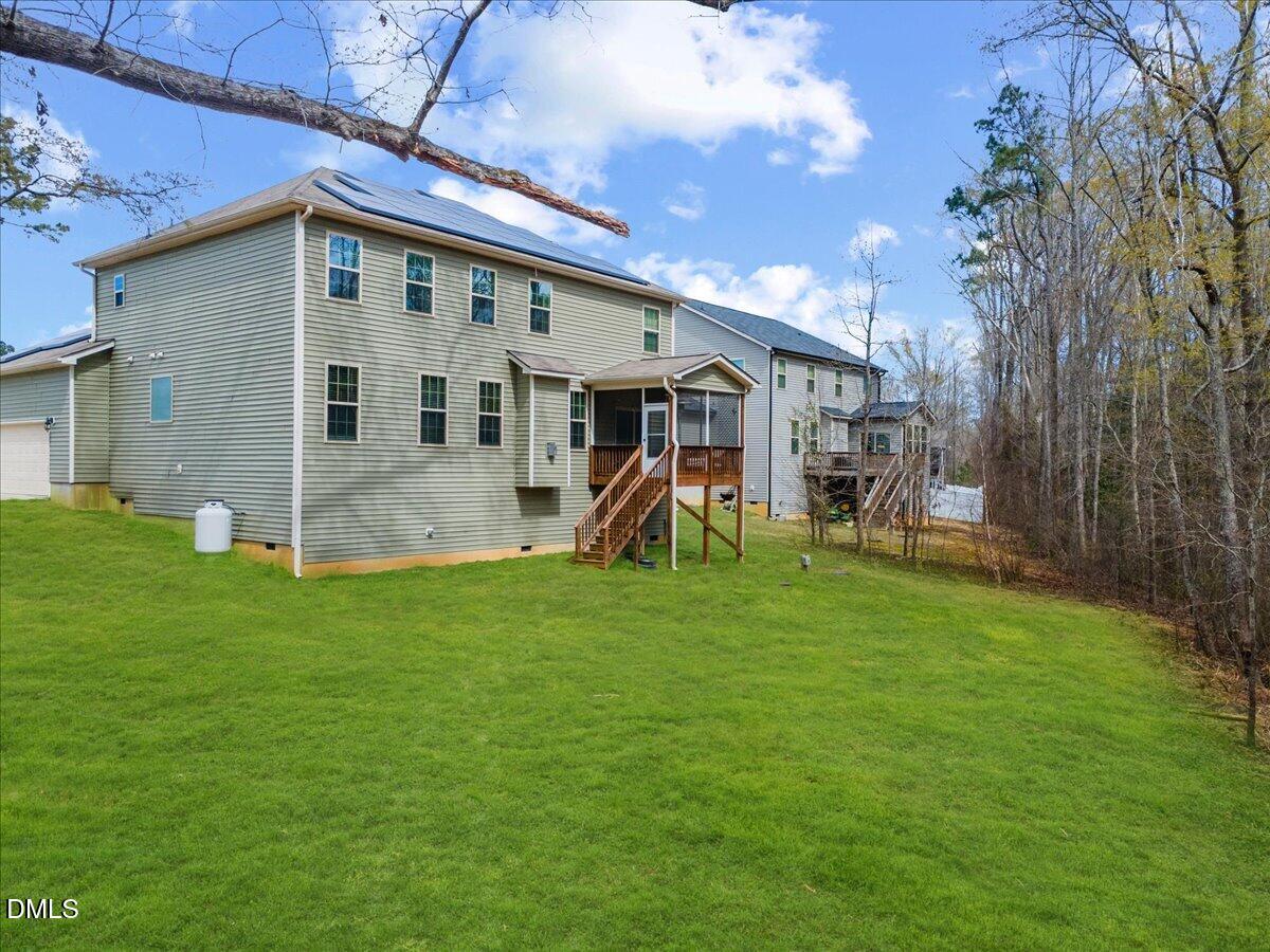 7804 Charters End Street Willow Spring, NC 27592 - Photo 38 of 43 a view of a house with a backyard