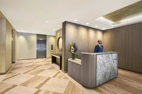 a view of a living room a bathroom and a sink