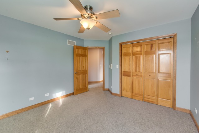 501 West Edgewood Road Lombard, IL 60148 - Photo 11 of 12 an empty room with closet and a ceiling fan