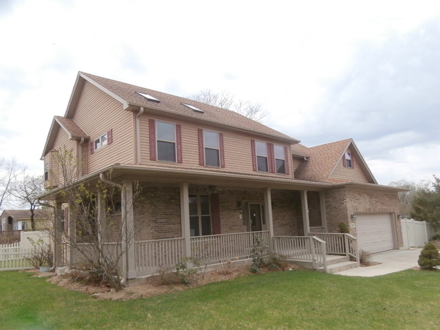 501 West Edgewood Road Lombard, IL 60148 - Photo 2 of 12 a front view of a house with a yard