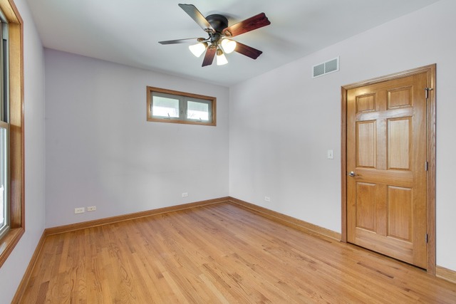 501 West Edgewood Road Lombard, IL 60148 - Photo 4 of 12 a view of an empty room with wooden floor