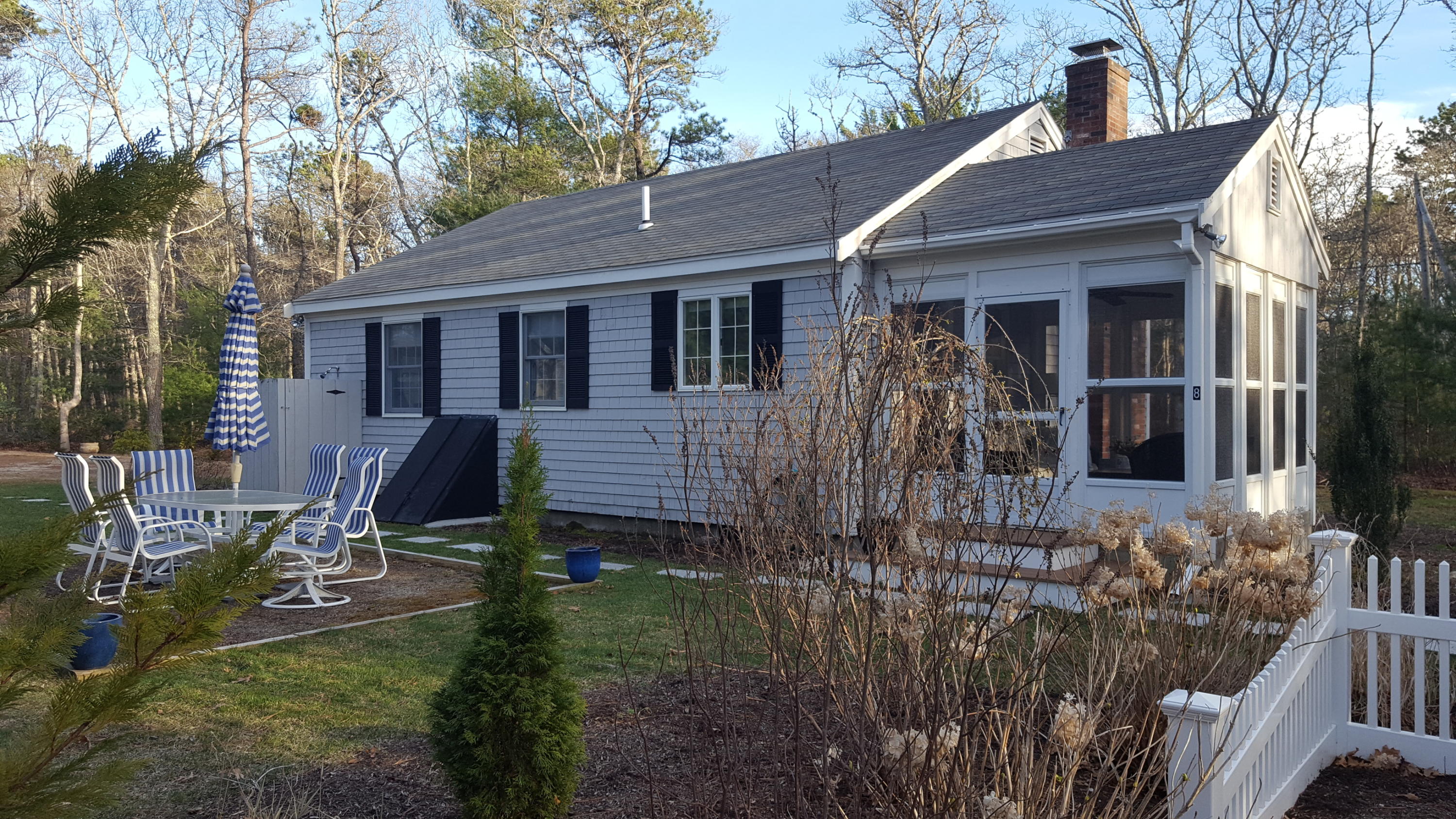 8 Nehoiden Road Mashpee, MA 02649 - Photo 1 of 47 a view of a house with backyard and sitting area